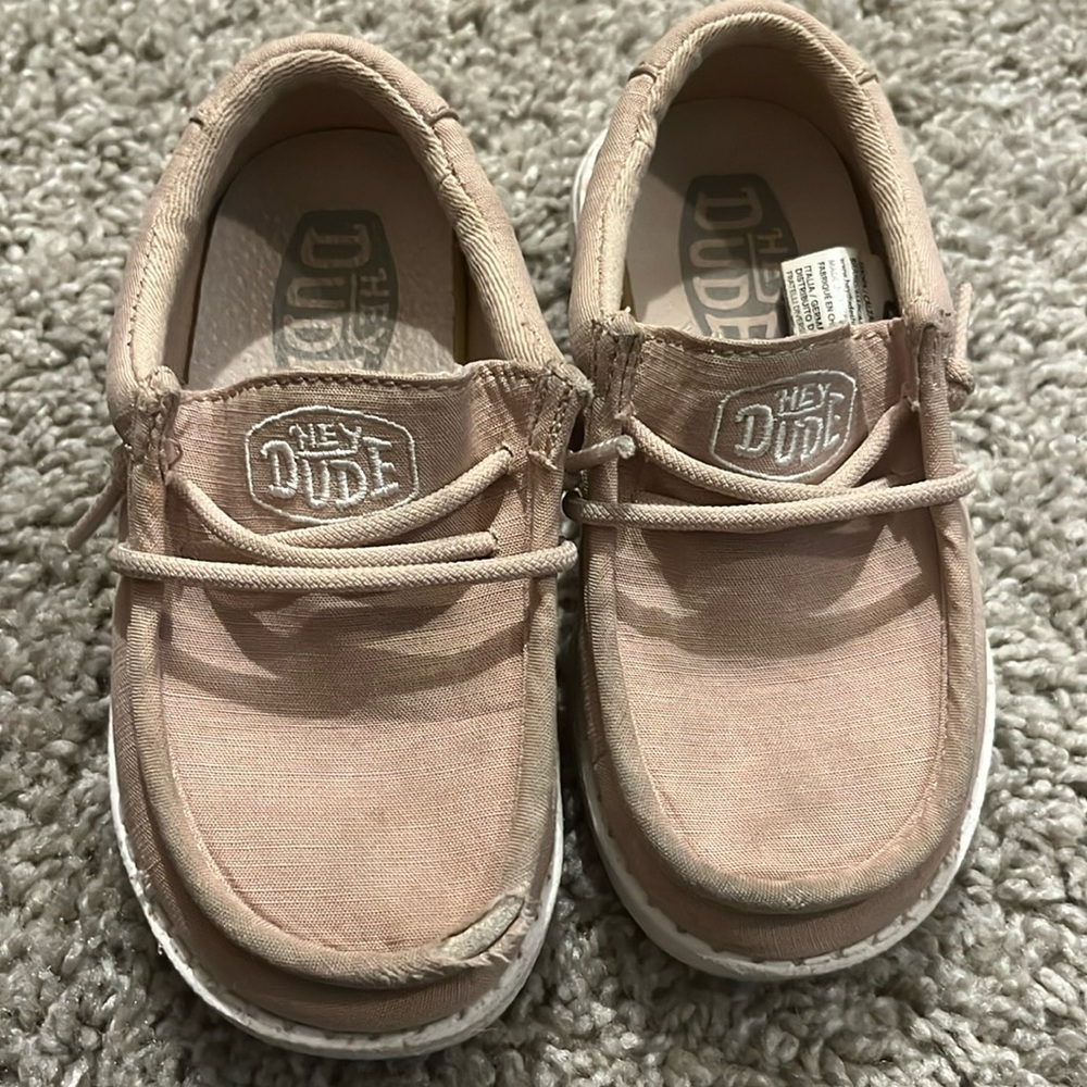 Toddler size 8 slip on shoes Hey Dude. A bit worn but still have some life!